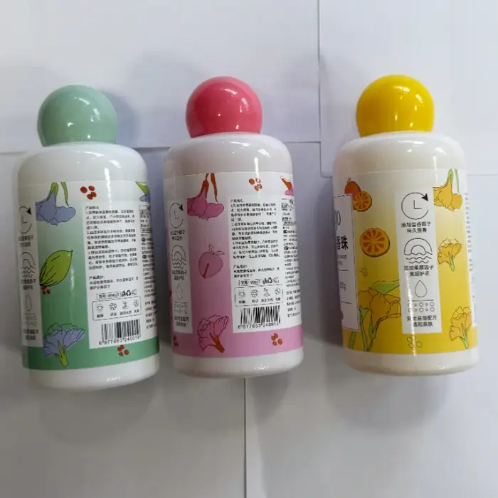 Lessive en perles en bouteille : Parfum longue durée, protection des couleurs, adoucissant, senteur fraîche
